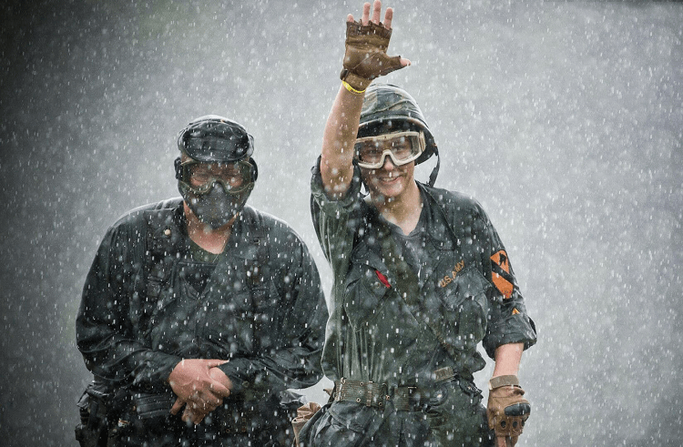 Two Guys Playing Airsoft In The Rain